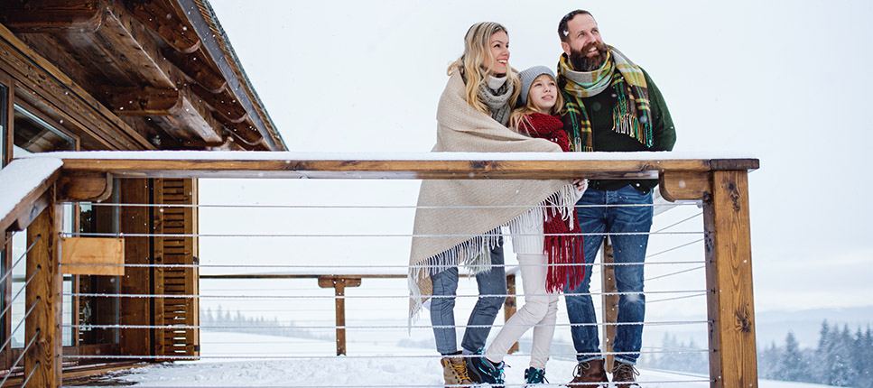family in balcony during winter